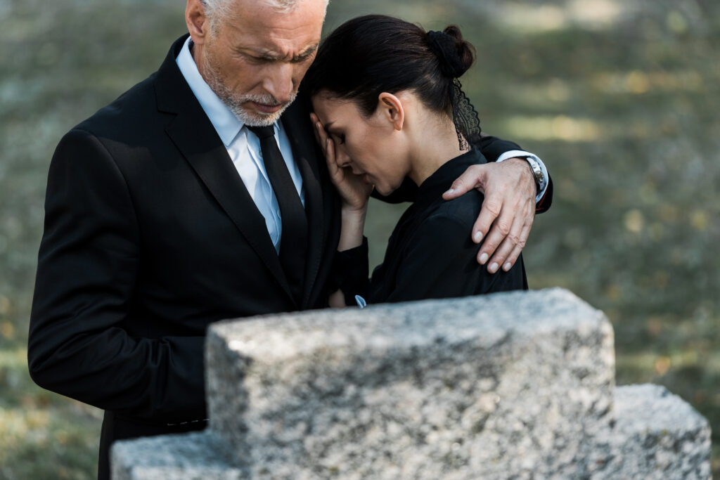 a couple mourning the loss of a loved one