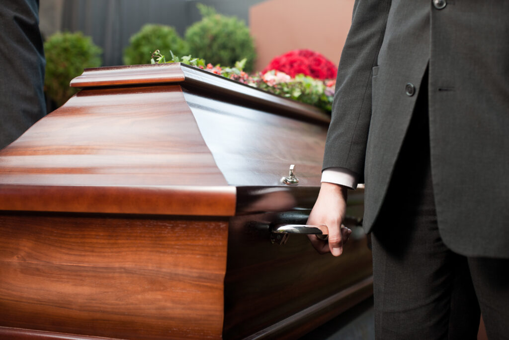 a coffin being carried by men